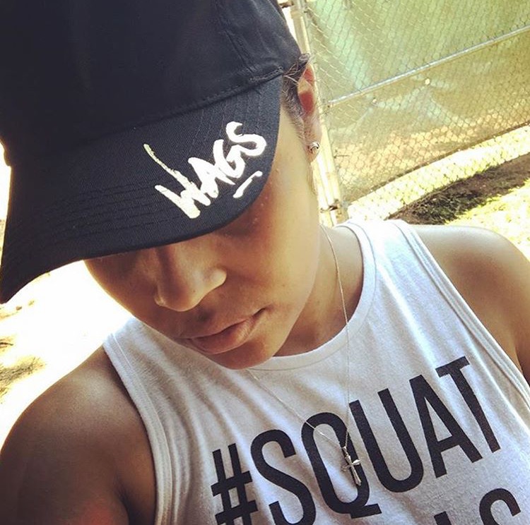 Member in a WAGS Redefined cap and a #SQUAT workout tank