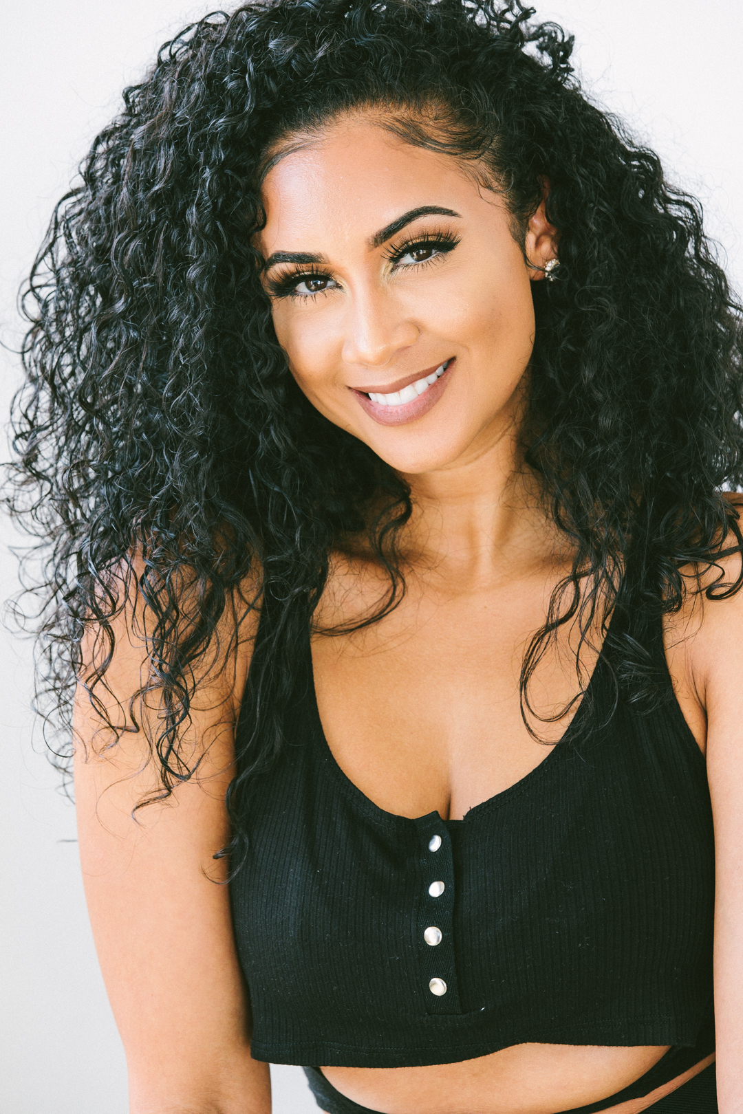 Attendee photographed smiling in the on-site portrait studio