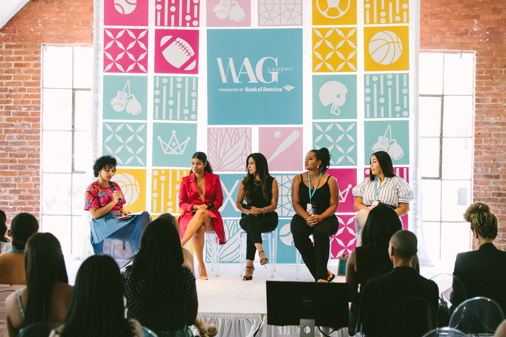 WAGcademy conference panel on stage in front of the WAGcademy presented by Bank of America backdrop