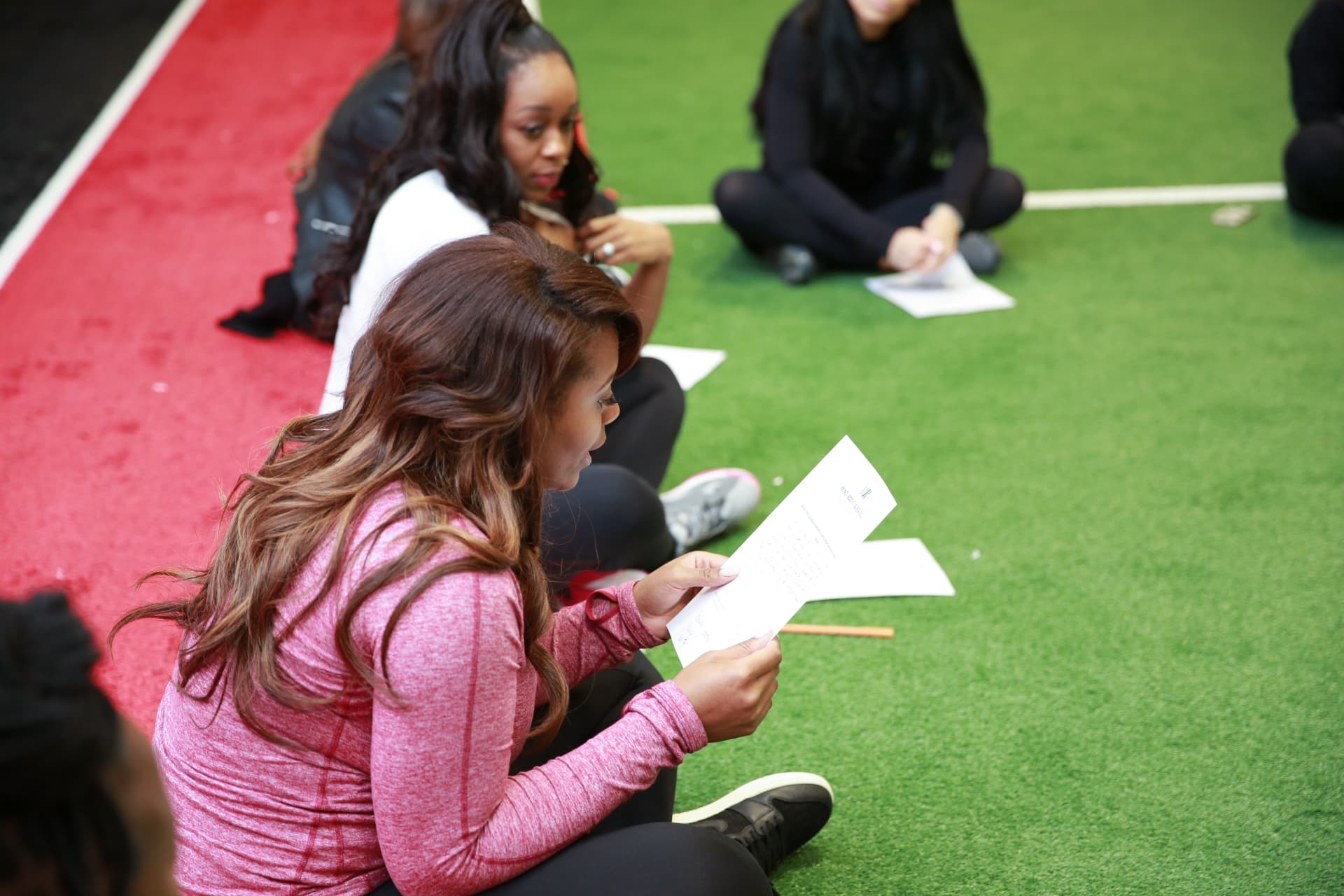 Member reading back her written reflection after the guided meditation