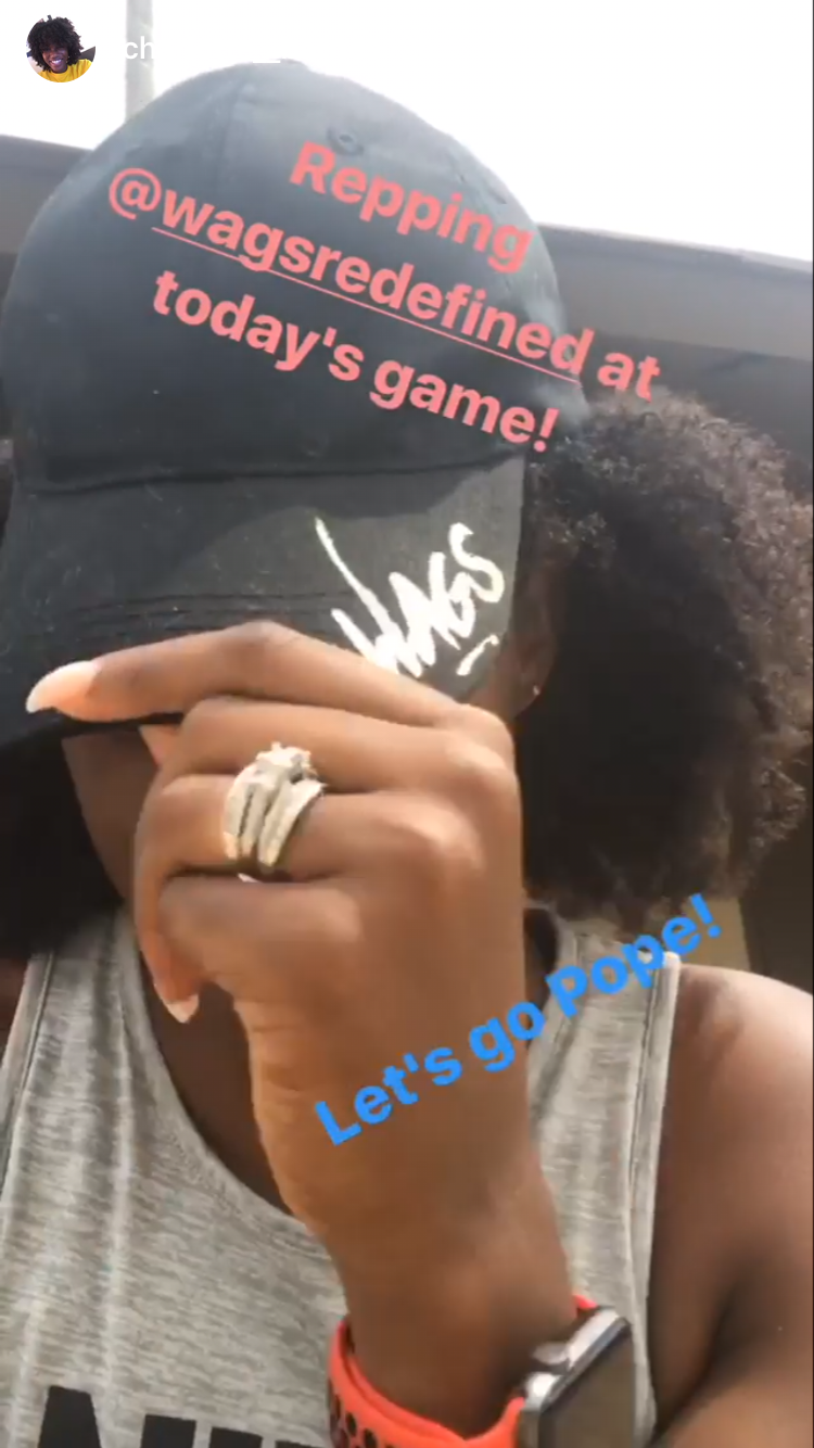 Instagram story of a member in a WAGS Redefined cap captioned 'Repping @wagsredefined at today's game!'