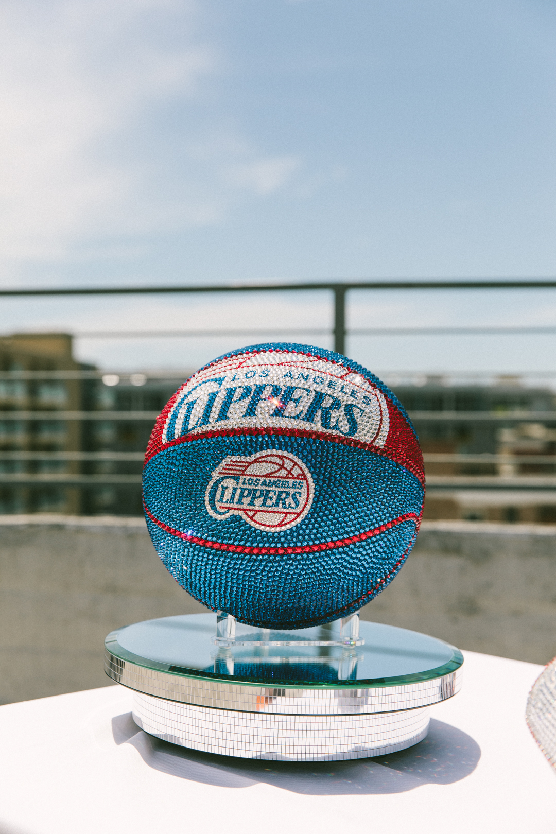 Crystal-covered Los Angeles Clippers basketball on a mirrored plinth