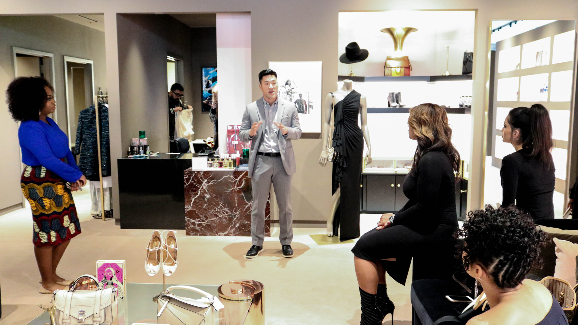 Store stylist walking guests through the exclusive shopping experience
