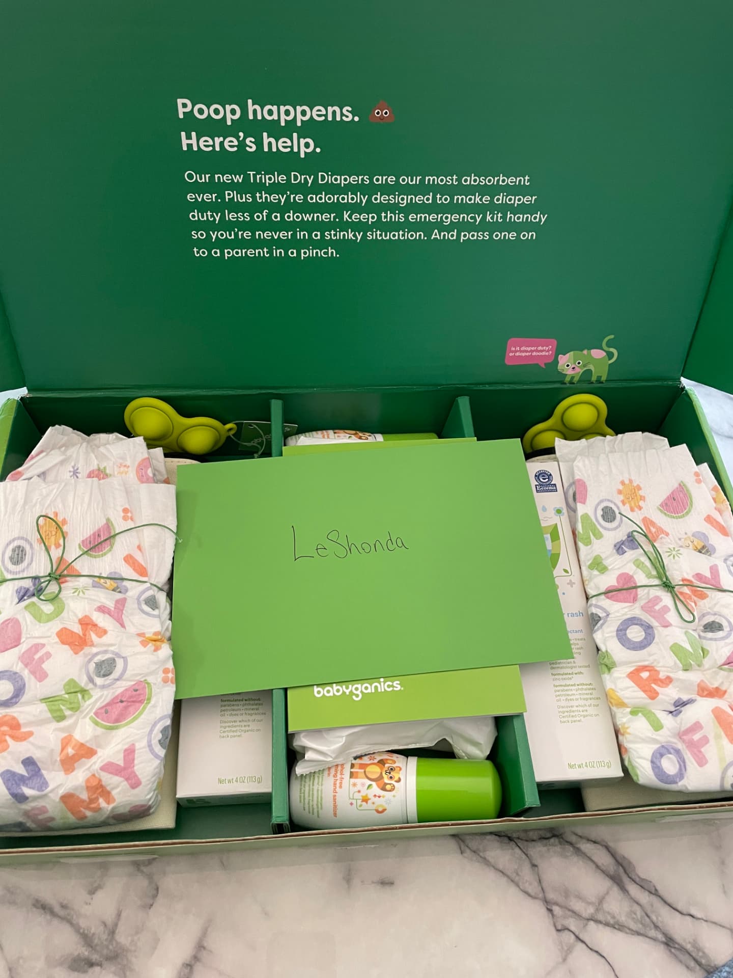 Opened Babyganics PR box with a hand-addressed card reading LeShonda, Triple Dry diapers, hand sanitizer and diaper rash cream