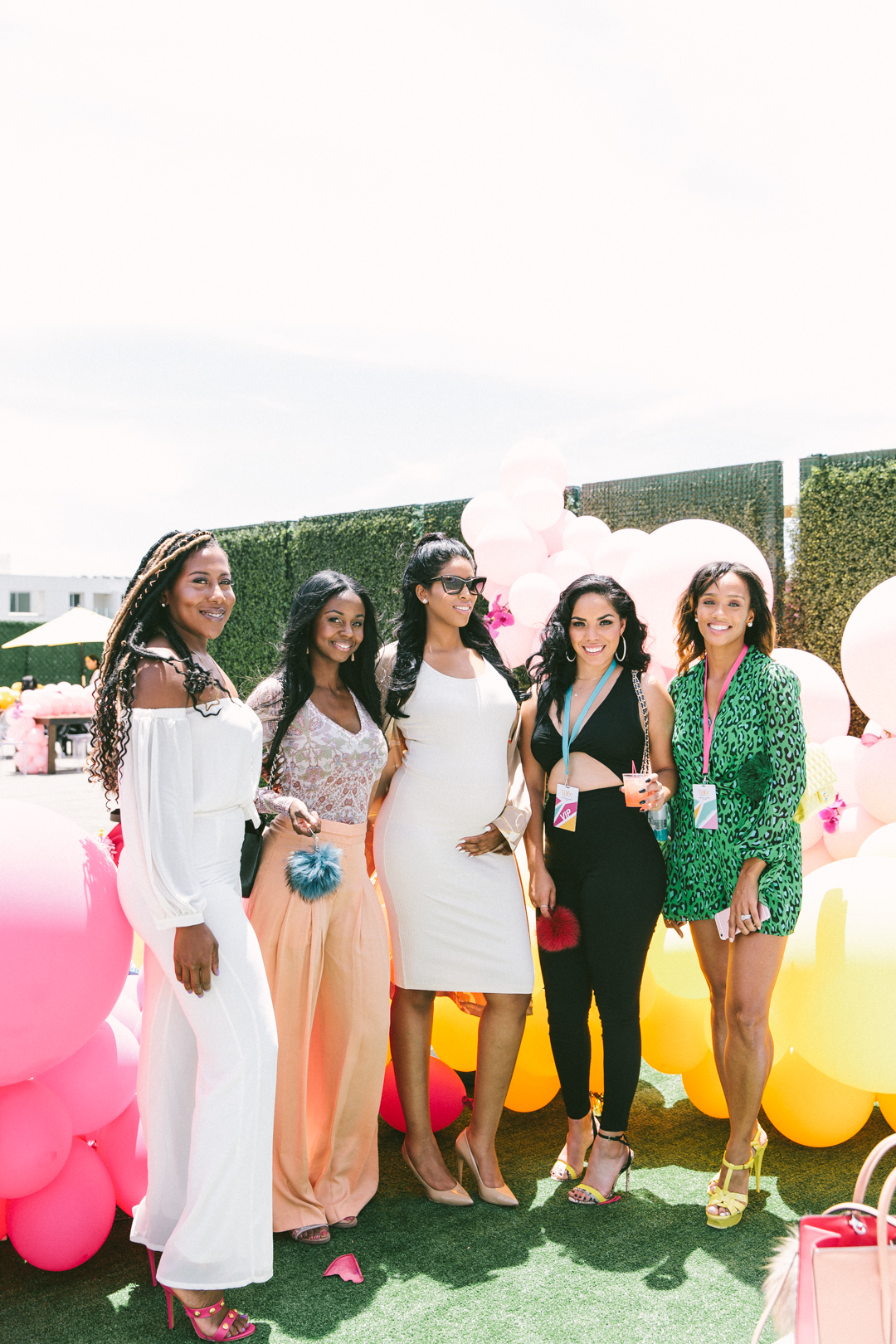 Group of WAGcademy attendees photographed together at the rooftop reception